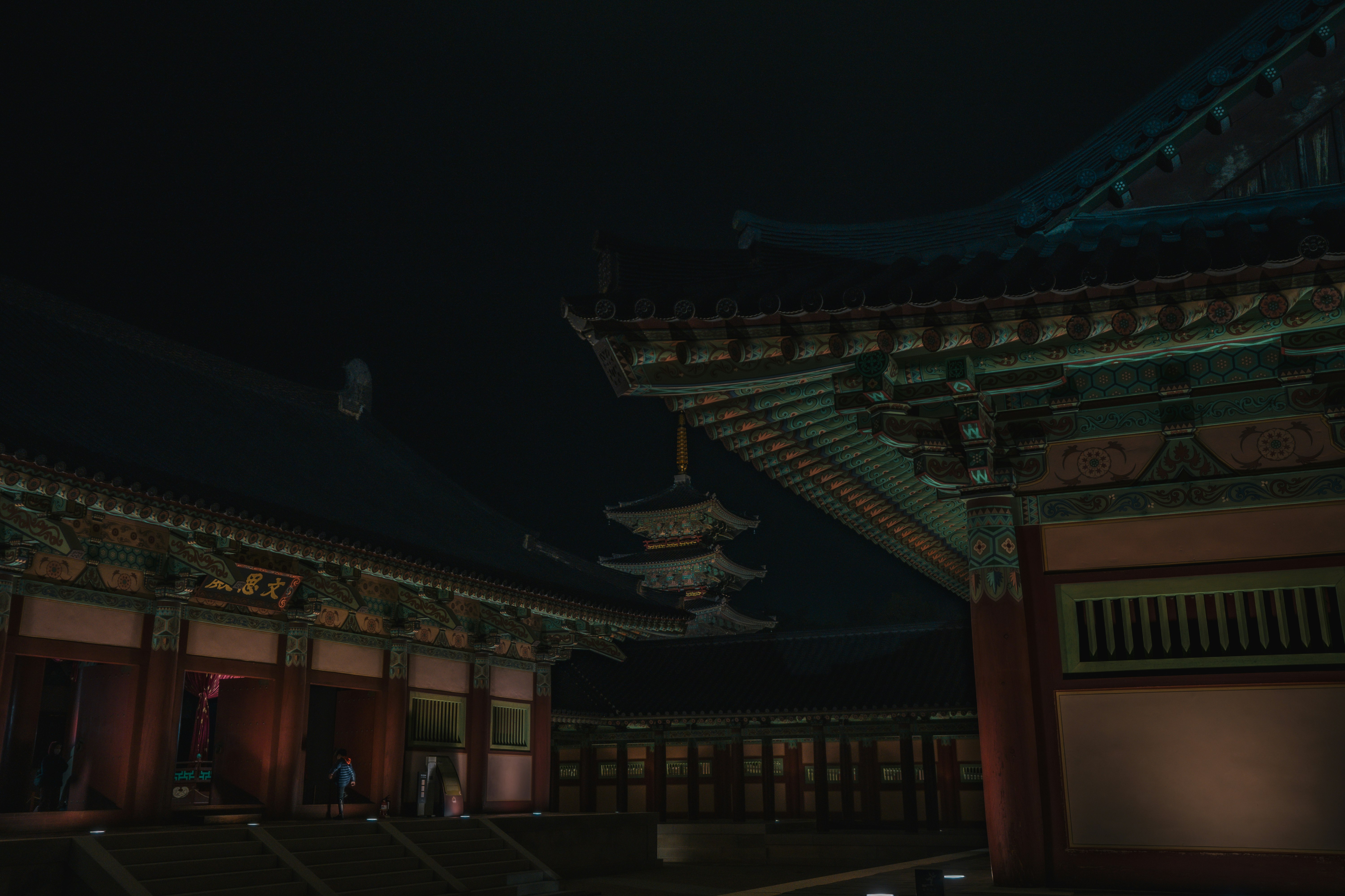 brown and green temple during night time